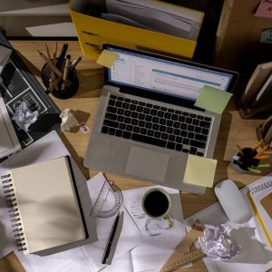 65e5a74ad76d2b55bf73dbd6_view-office-desk-with-messy-workspace-laptop (1)-p-1600